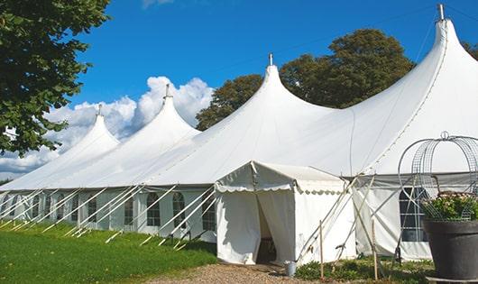 a line of sleek and modern portable restrooms ready for use at an upscale corporate event in Oakboro, NC